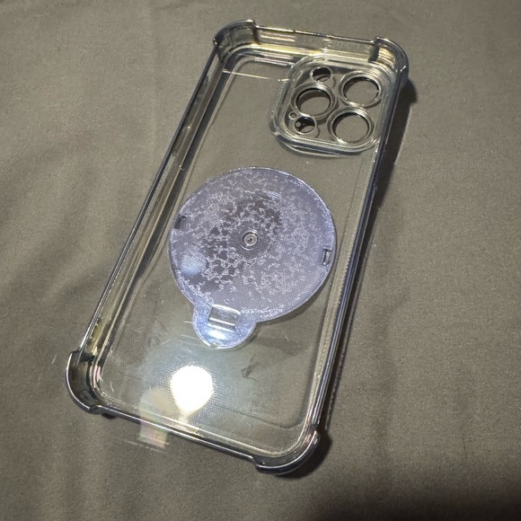 Clear Phone Case with Blue Accents For a 15 Pro Max. Spinning wheel in Center. - Picture 2 of 14